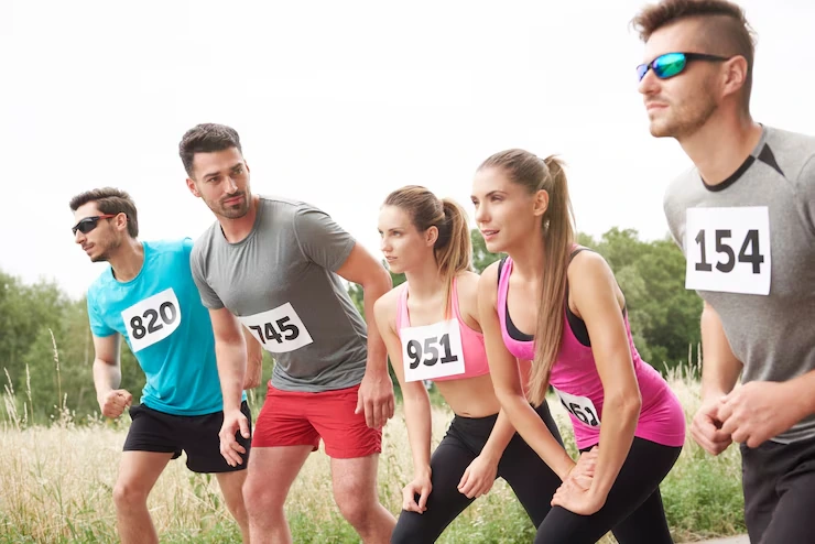 group-of-athletes-ready-for-race-standing-at-start-line